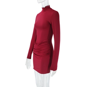 Detail view of red slim fit mini dress featuring side ruching and a sleek stand collar