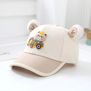 Close-up of baby baseball cap featuring 3D plush ears and cute bear excavator patch