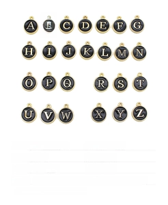 Detail view of 12mm round alloy letter charms with black enamel and gold plating