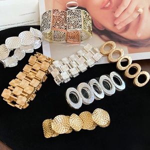 Close-up of bohemian metal bracelets set with hammer texture and vintage patterns