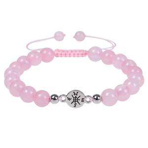 Detail of pink natural stone beaded bracelet with silver compass charm and braided cord