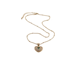 Detailed shot of golden bead chain with a heart pendant featuring a dark green gemstone
