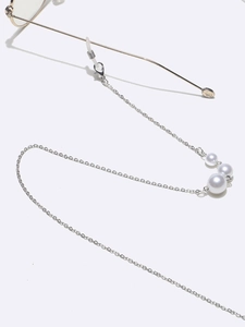 Elegant silver metal eyewear chain featuring three linear white pearls and silicone loops