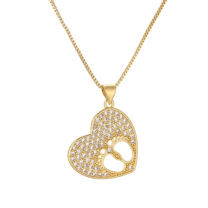 Golden heart moon necklace with pavé zircon baby footprints on a box chain link