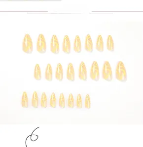 Detailed set of 24 yellow marble patterned almond press-on nails on white background