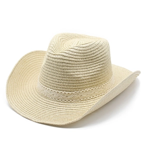 Detail of beige straw jazz hat featuring intricate woven texture and lace decorative band