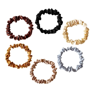 Set of six colorful satin silk scrunchies in assorted earthy and neutral tones
