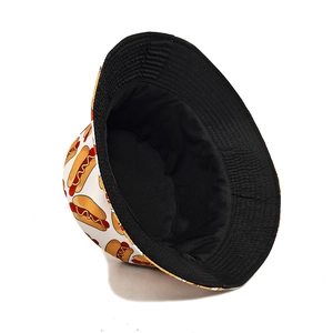 Reversible bucket hat with cartoon hot dog print and black interior for sun protection