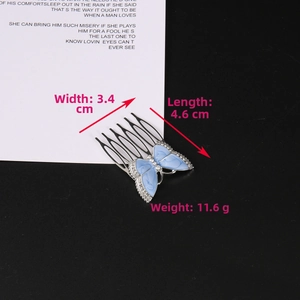 Blue butterfly hair comb with enamel wings and rhinestones measuring 3.4cm by 4.6cm