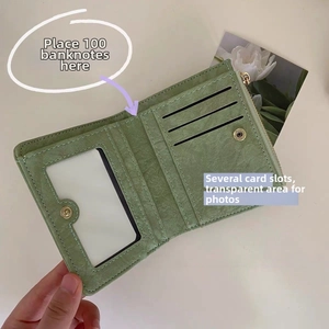 Interior layout of green vintage wallet showing card slots and photo window
