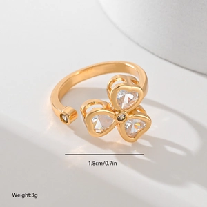 Detail view of gold-plated leaf ring with heart-shaped zircon stones and dimensions