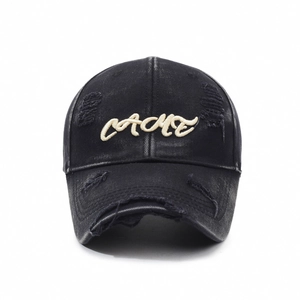 Vintage washed black baseball cap with CACHE embroidery and distressed ripped details