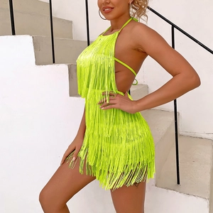 Detail of neon green fringe mini dress with halter neck and open back design