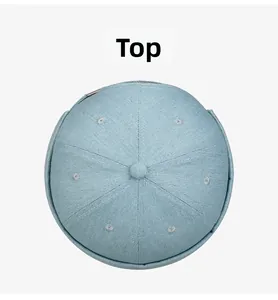 Top view of a light blue denim docker hat showing the six-panel crown and fabric button