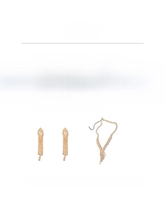 Detail of luxury gold plated necklace and long tassel earrings set with cubic zirconia