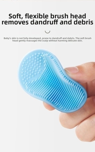 Macro view of blue silicone baby cradle cap brush with soft bristles for scalp cleaning