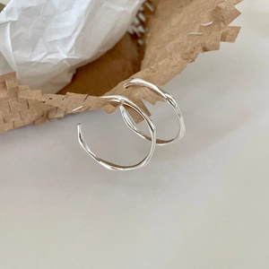 Polished 925 sterling silver Mobius hoop earrings with minimalist irregular wave design