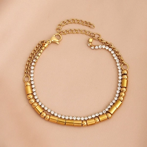 Macro detail of gold-plated double-layer bracelet with crystal stones and metal beads