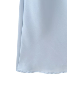 Detail of light blue satin dress showing professional hem stitching and silky fabric texture