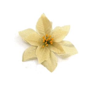 Macro view of champagne gold artificial Christmas poinsettia with glitter petals