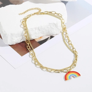 Detail of layered gold chain necklace featuring a colorful rainbow pendant with oil drip finish