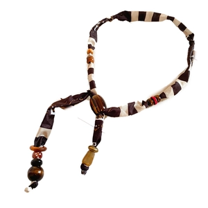 Minimalist fabric and wood beaded necklace with brown stripes in a bohemian style