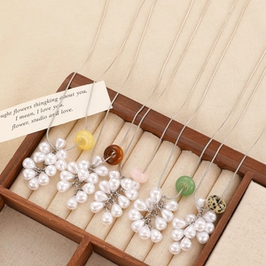 Elegant faux pearl flower necklaces with colorful stone charms on silver snake chains