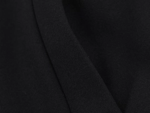 Macro shot of black fabric texture with stand collar coat twill weave and soft luster