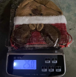 Weight measurement of a Christmas reindeer burlap drawstring gift bag with plush trim