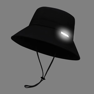 Waterproof black bucket hat for women with reflective patch and adjustable chin strap