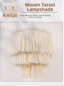 Detailed close-up of bohemian hand-woven cotton rope lamp shade with long layered tassels