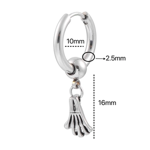 Macro detail of punk earring showing 10mm inner ring and skull hand pendant
