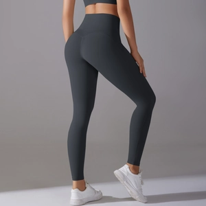 Detail view of high-waisted seamless charcoal grey yoga pants with booty lifting design