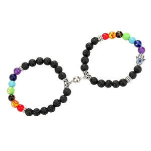 Detail of magnetic couple bracelets with volcanic lava stones and chakra beads