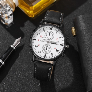 Close-up of Geneva men's quartz watch with black leather strap on a textured surface