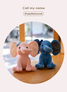Detailed close-up of pink and blue plush elephant toys with cute bow ties on a wooden surface