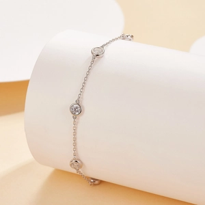 Detail view of the delicate silver S925 bracelet with round clear zircon stones
