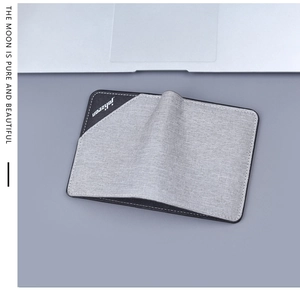 Vertical top view of ultra-thin grey canvas wallet with black leather logo detail