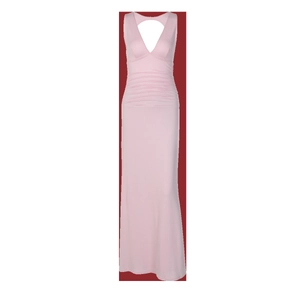 Detailed view of deep V-neckline and waist ruching on this light pink slim maxi dress
