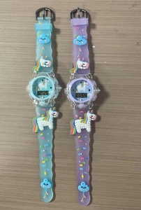 Detail of 3D cartoon unicorn digital watches with colorful silicone straps for kids