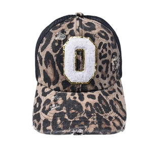 Detail of leopard print trucker hat with chenille O patch and distressed mesh back