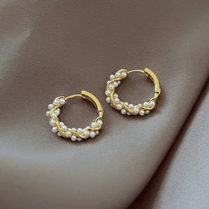 S925 silver needle twisted gold hoop earrings with white pearls on silk background