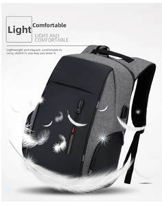 Detail of multi-functional laptop backpack showing side USB port and waterproof grey fabric