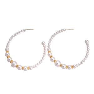 Elegant C-shaped pearl hoop earrings with gradient size white beads and gold accents