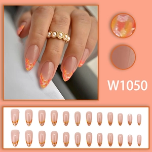 French almond press-on nails with fall orange leaf glitter and silver foil details