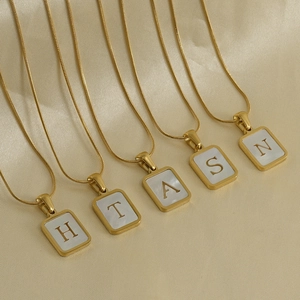 Gold 18K stainless steel snake chain necklaces with shell initial pendants on silk