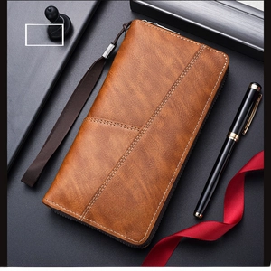 Close-up of khaki leather long wallet with zipper and detachable hand strap for men
