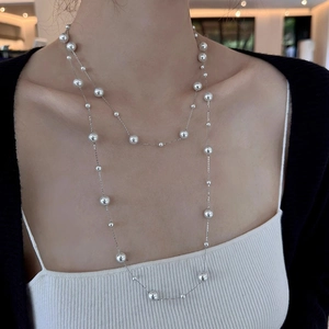 Elegant double-layer long necklace with white faux pearls and silver-tone metal chain