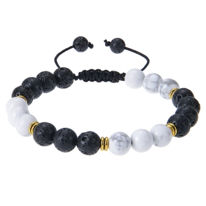 Macro detail of 8mm lava rock and white stone beads on adjustable braided bracelet