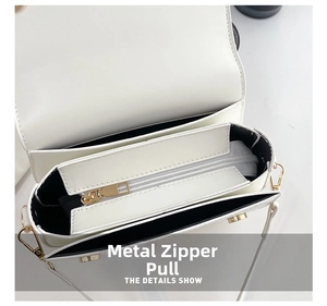Detail view of the internal compartment with gold zipper and smooth white PU leather